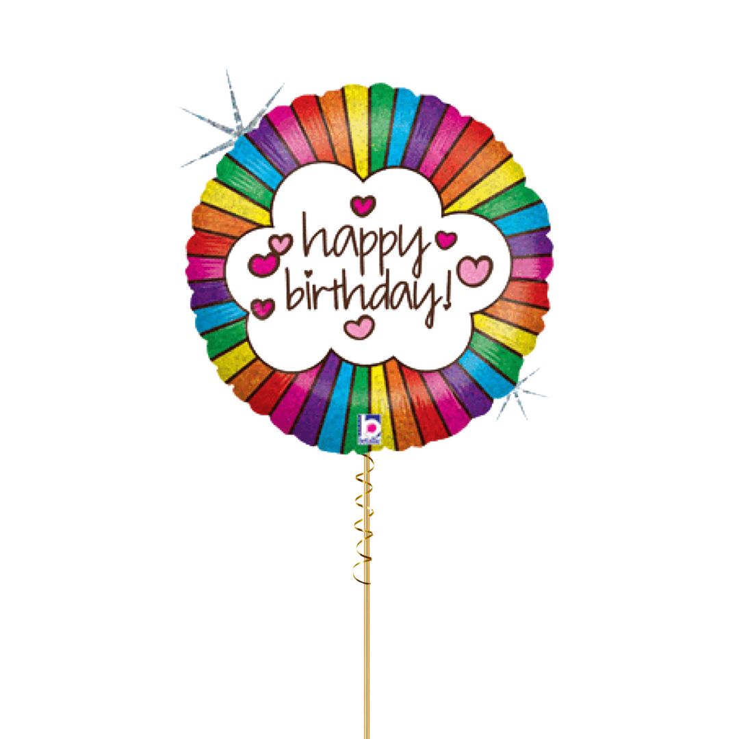 A round Retro Rainbow foil balloon on a ribbon with a rainbow-coloured striped border and a white centre that reads 'happy birthday!' in brown script, accented with small pink hearts and sparkles.